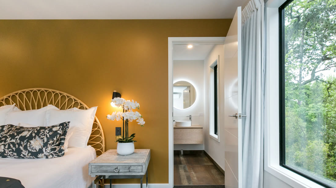 Bedroom with a feature wall and ensuite