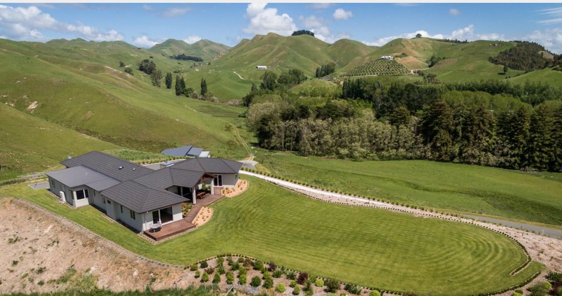 Aerial view of a dark-clad Palmer Builders home in rural Hawke's Bay
