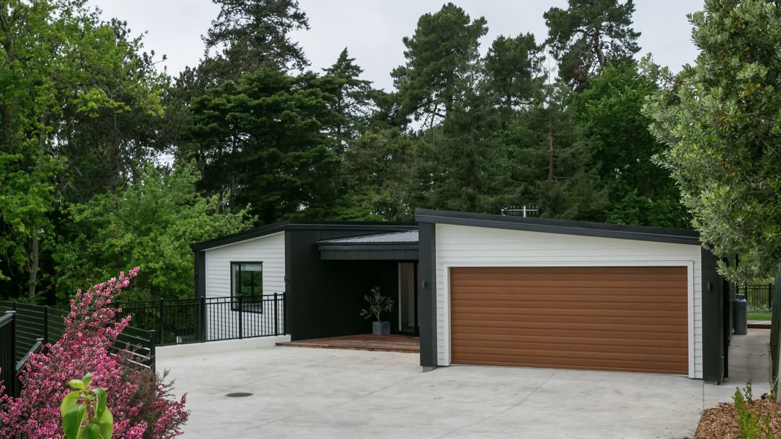 Single-storey home with double garage and landscaped driveway